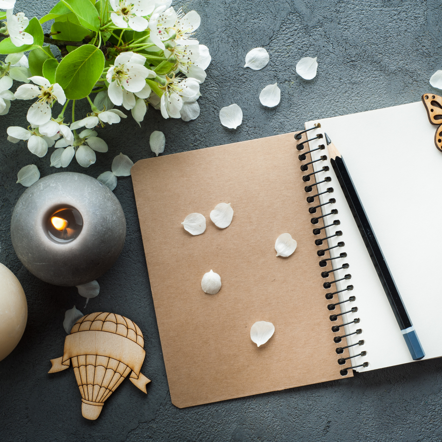 An open journal sitting on a desk waiting to be written in